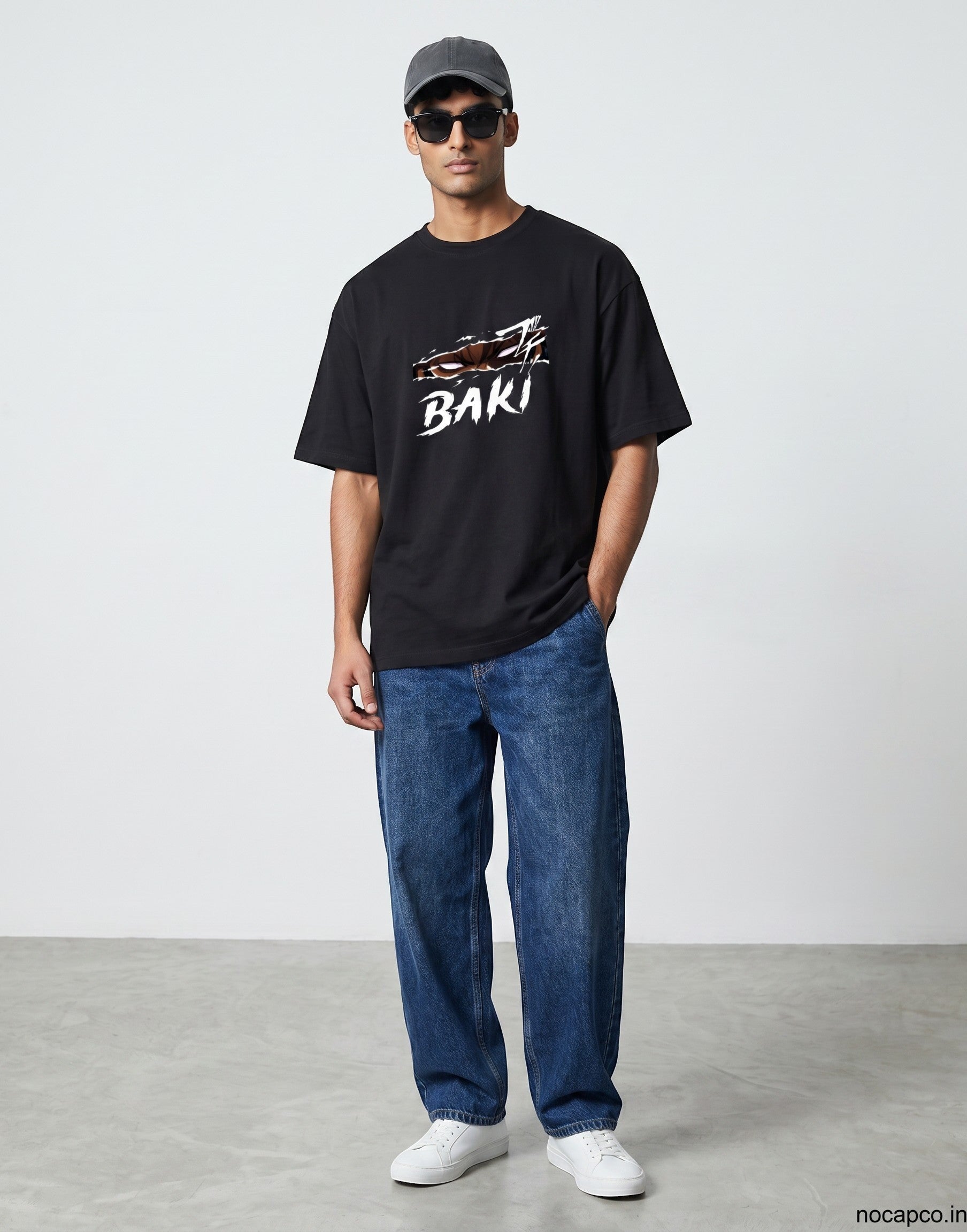 No Cap Co black 100% cotton t-shirt with white 'BAKI' graphic and ripped effect design. Unisex fit.
