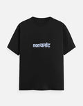 No Cap Co black 100% cotton unisex t-shirt with subtle white "NONCHALANT" text print on chest.