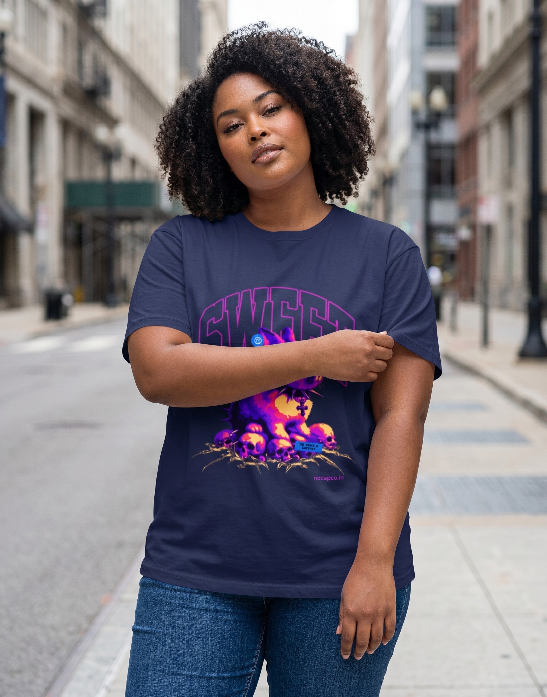 No Cap Co navy blue 100% cotton crew neck t-shirt with a graphic print of a purple bunny wearing a spiked collar and surrounded by skulls.