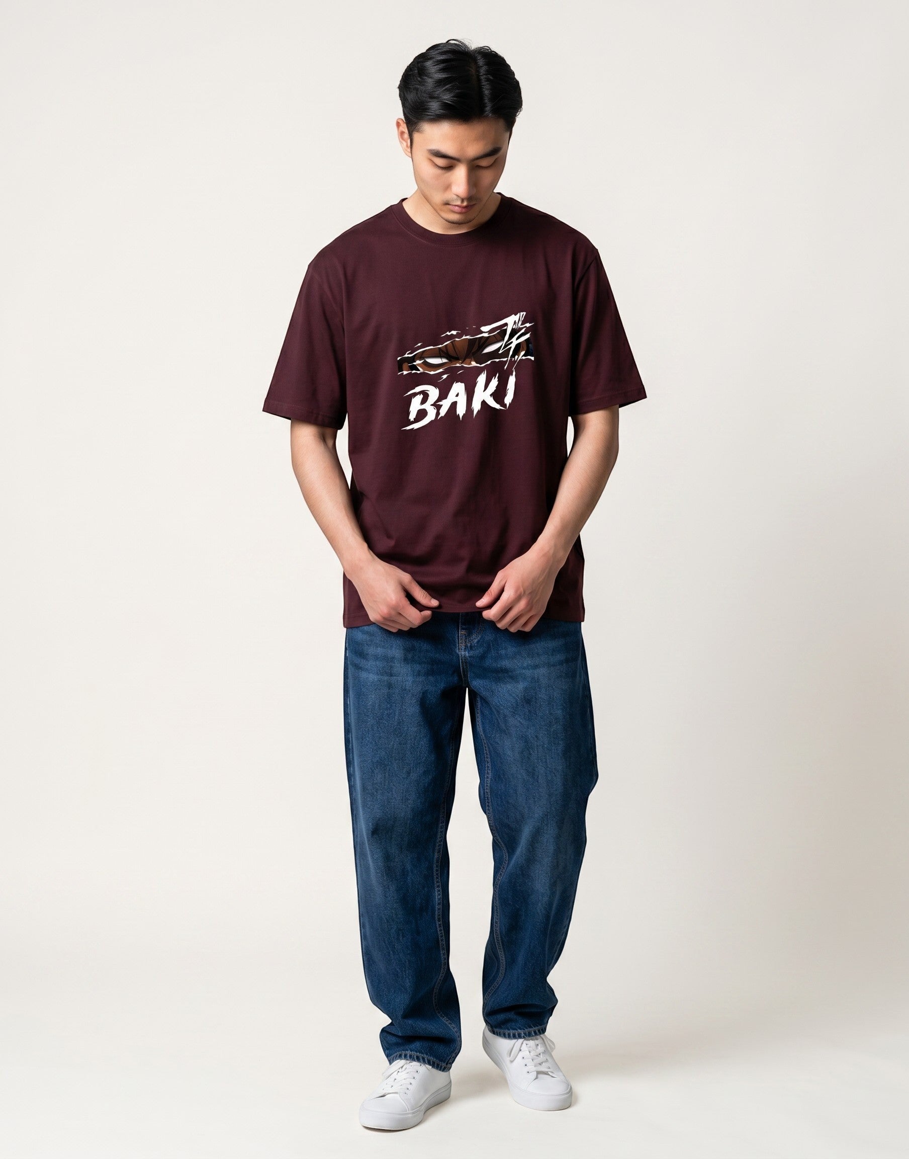 No Cap Co burgundy 100% cotton t-shirt with a ripped graphic design and the word BAKI in white.