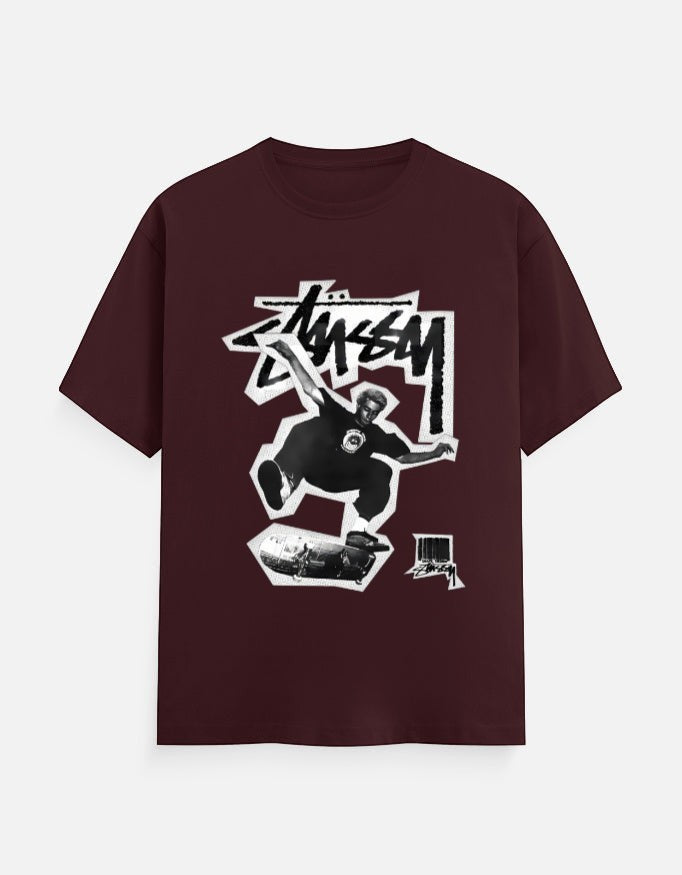 No Cap Co burgundy 100% cotton t-shirt with a graphic print of a skateboarder mid-air and the brand logo.