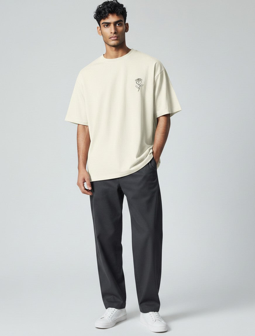 No Cap Co cream cotton t-shirt with embroidered rose graphic on chest, crew neck, relaxed fit.