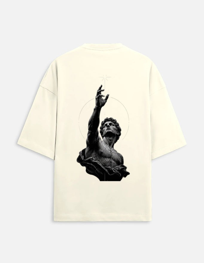 No Cap Co cream oversized t-shirt with a graphic print of a classical statue reaching upwards, surrounded by a subtle circle and star.
