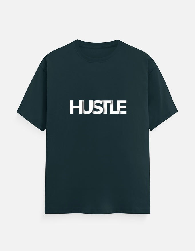 No Cap Co dark teal 100% cotton unisex regular fit t-shirt with bold white 'HUSTLE' text graphic.