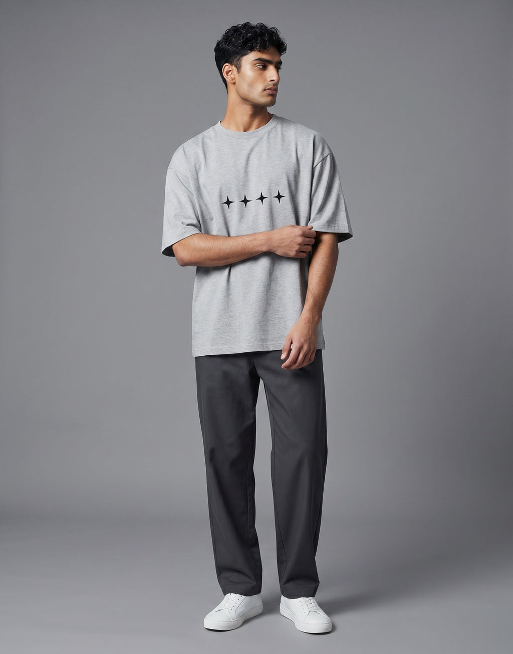 No Cap Co grey oversized cotton t-shirt with four black star graphic print on chest.