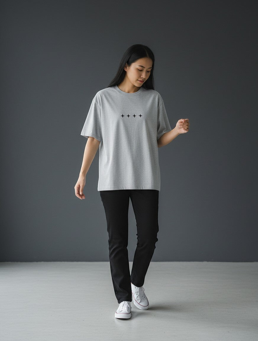 No Cap Co grey oversized t-shirt with a minimalist print of four black stars in a row. Made from premium 240 GSM cotton-polyester blend.