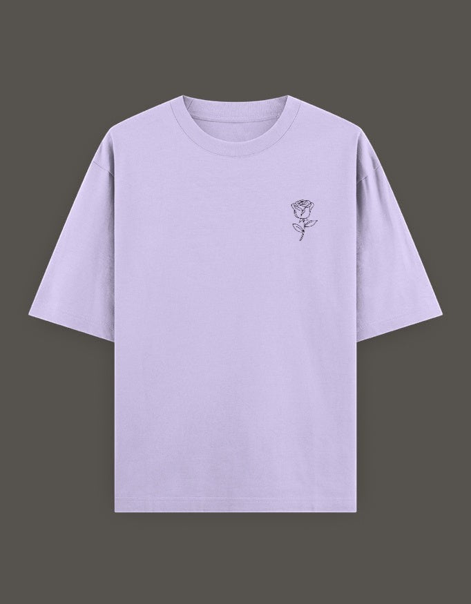 No Cap Co oversized lavender t-shirt with a small black rose graphic on the left chest. Made from 240 GSM cotton-polyester blend.
