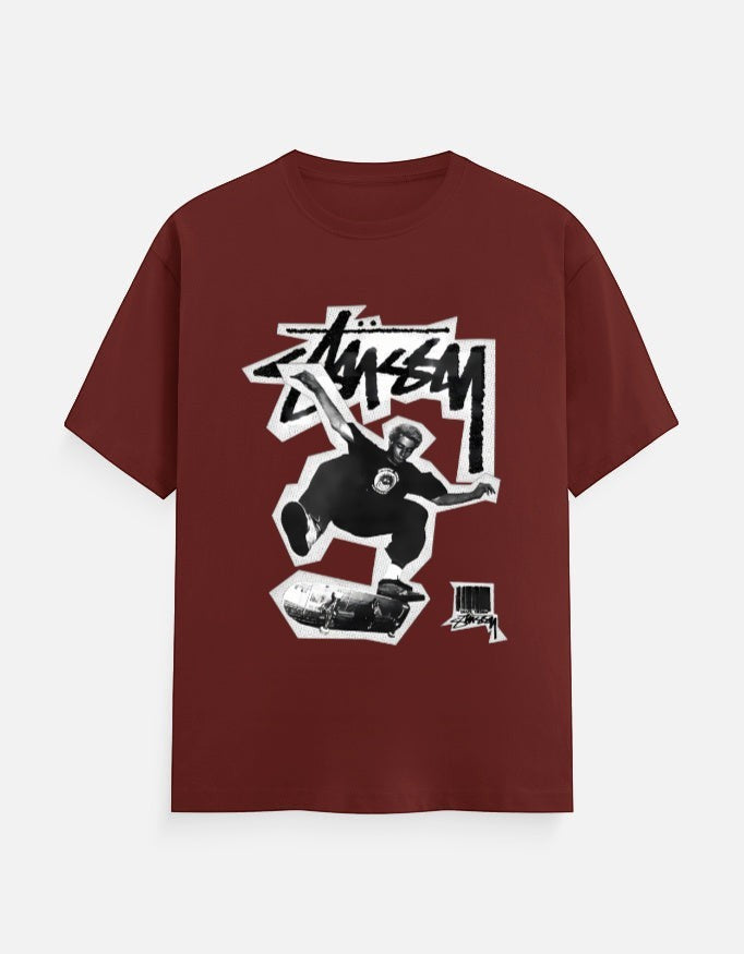No Cap Co maroon 100% cotton t-shirt with a graphic print of a skateboarder mid-air and the brand logo.