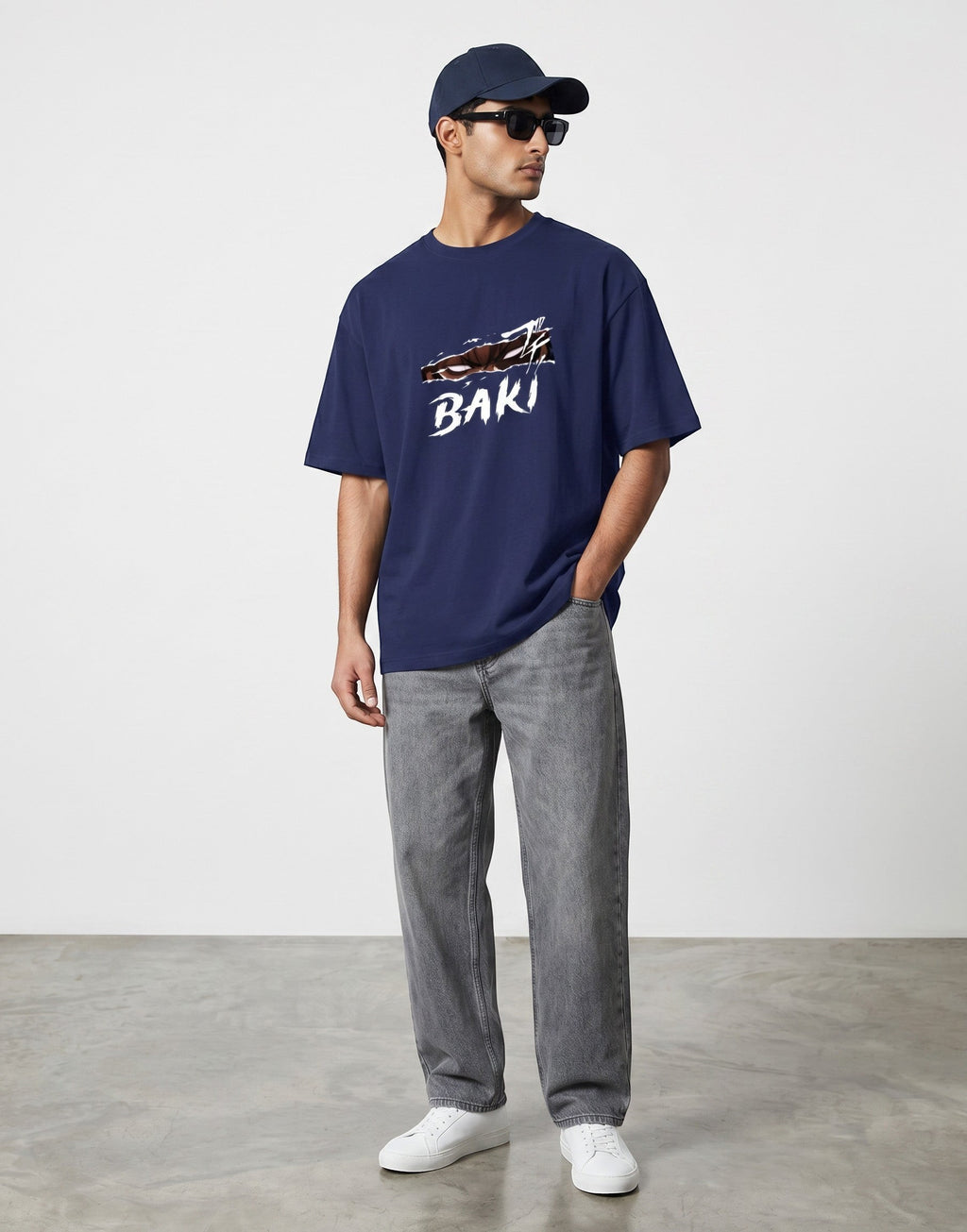 No Cap Co navy blue 100% cotton unisex t-shirt with a white 'BAKI' graphic and a slashed design.