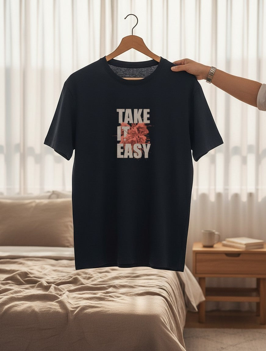 No Cap Co navy blue 100% cotton t-shirt with "TAKE IT EASY" graphic print and floral detail.