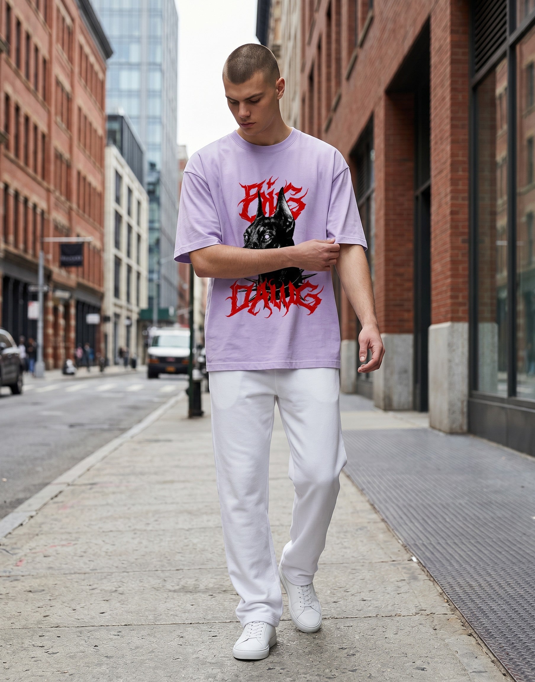 No Cap Co oversized lilac t-shirt with a graphic of a black Doberman wearing a spiked collar and red gothic text.