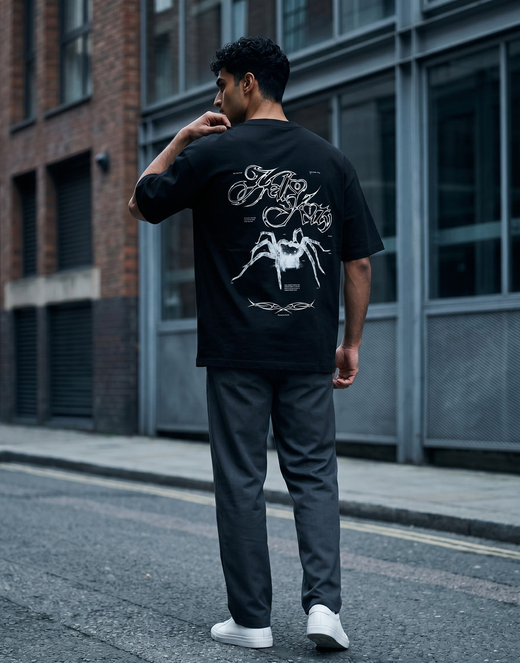 No Cap Co black oversized cotton t-shirt with a graphic spider and text print on the back.