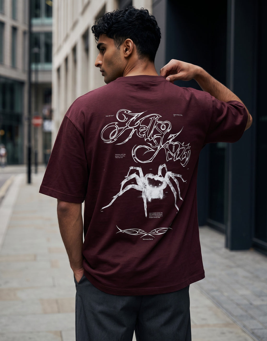 No Cap Co burgundy oversized cotton t-shirt with a white spider graphic and text print on the back.