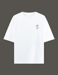 No Cap Co white oversized t-shirt with a small black rose graphic on the left chest. Made from 240 GSM cotton-polyester blend.